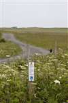 RSPB notice about managing field for Corncrake, machair flowers and waders