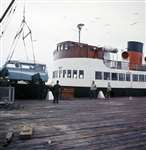 Dormobile being lifted on to steamer, Port Ellen