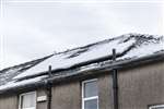 House in Glasgow with solar panels in the snow