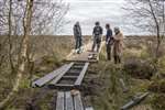 The Bog Squad constructing a board walk at Braehead Moss