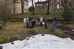 Glasgow University Wildlife Garden pond - unrolling the pond liner