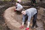 Glasgow University Wildlife Garden pond - Laura and Liam spreading sand