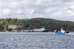 CalMac Ferry MV Hebridean Isles at Port Askaig and Argyll and Bute Council ferry Eilean Dhiura
