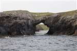 Natural Arch Geodh' an Tuill on Pabaigh Mòr on a Seatrek wildlife cruise on Loch Roag