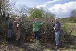 Ravenswood Bog, Cumbernauld, Froglife staff and volunteers making a hibernaculum