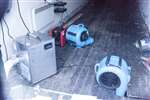 Dehumidifiers and heaters in a flood-damaged shop, Ballater